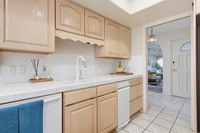 a view of a dining room with furniture wooden floor and chandelier