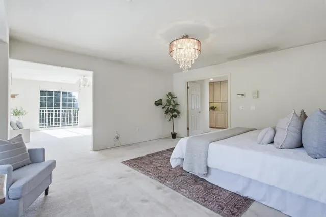 a bathroom with a granite countertop sink toilet a large mirror a shower and bathtub