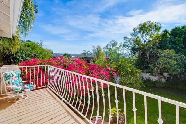 a front view of a house with garden and porch
