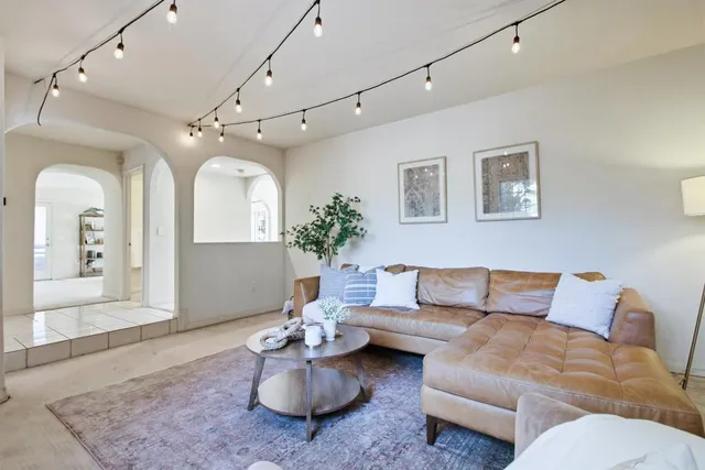 a dining room with a wooden table and chairs