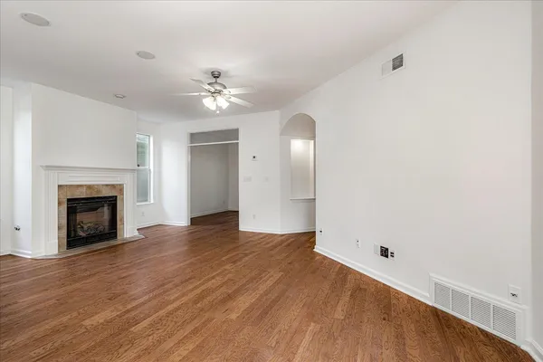 a kitchen with stainless steel appliances kitchen island granite countertop a stove and a sink