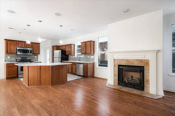 a kitchen with stainless steel appliances a sink stove and refrigerator
