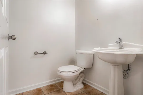 a spacious bathroom with a tub sink shower and mirror