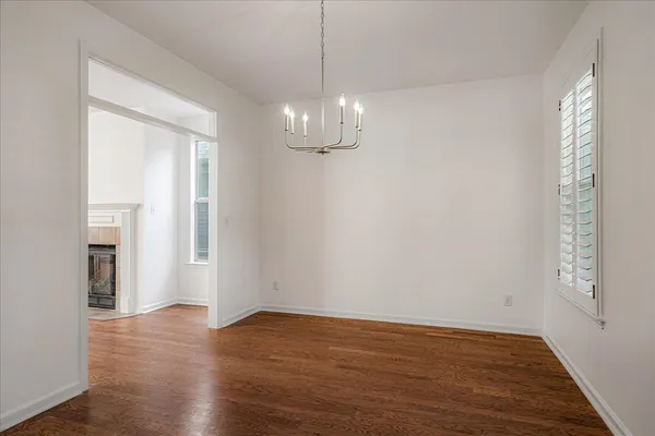 a kitchen with stainless steel appliances granite countertop a stove top oven a sink and a fireplace