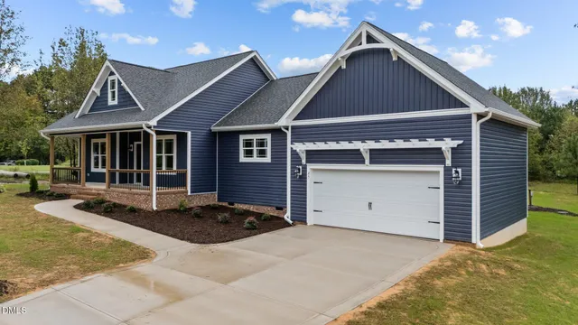 a front view of a house with a garage