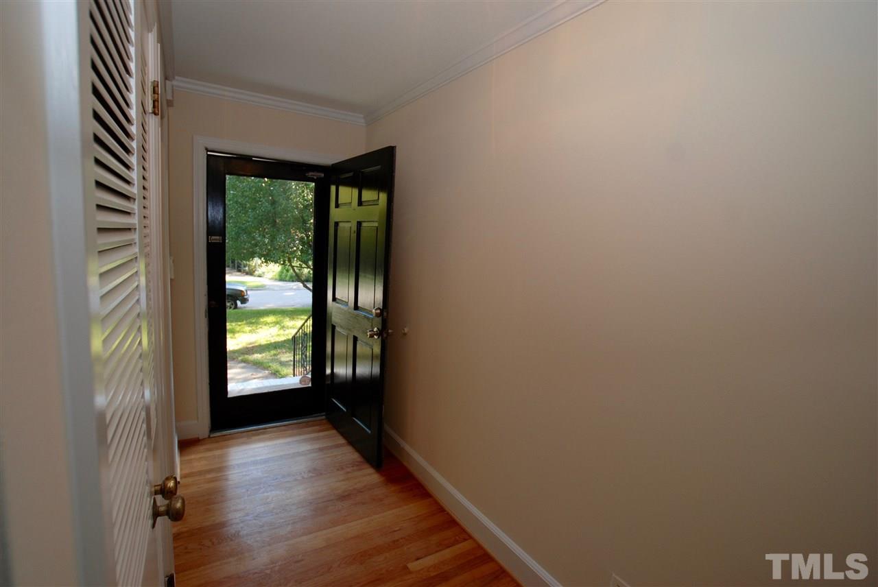 3404 Cherry Lane Raleigh, NC 27607 - Photo 2 of 19 an empty room with windows