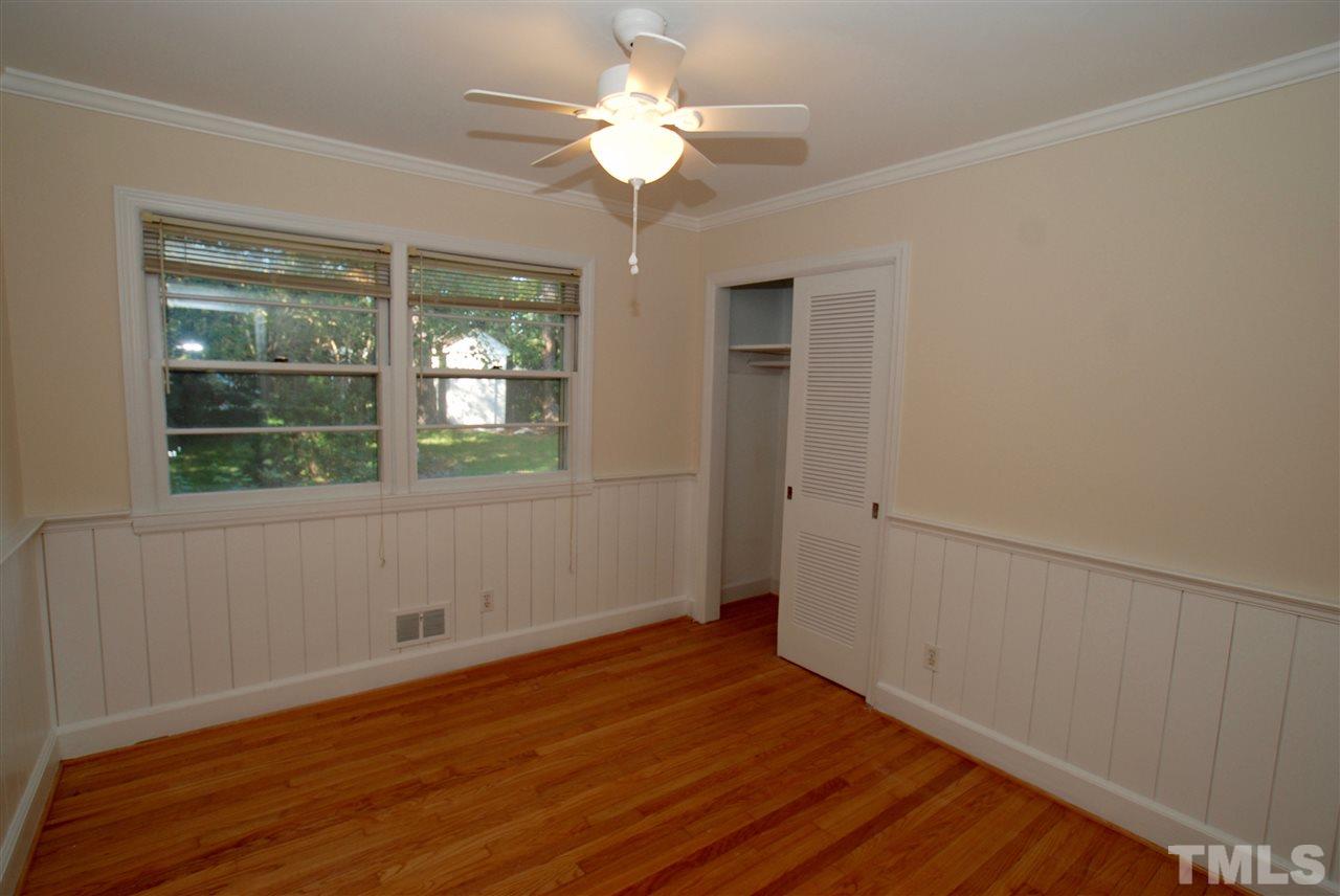 3404 Cherry Lane Raleigh, NC 27607 - Photo 11 of 19 a view of empty room with wooden floor and fan