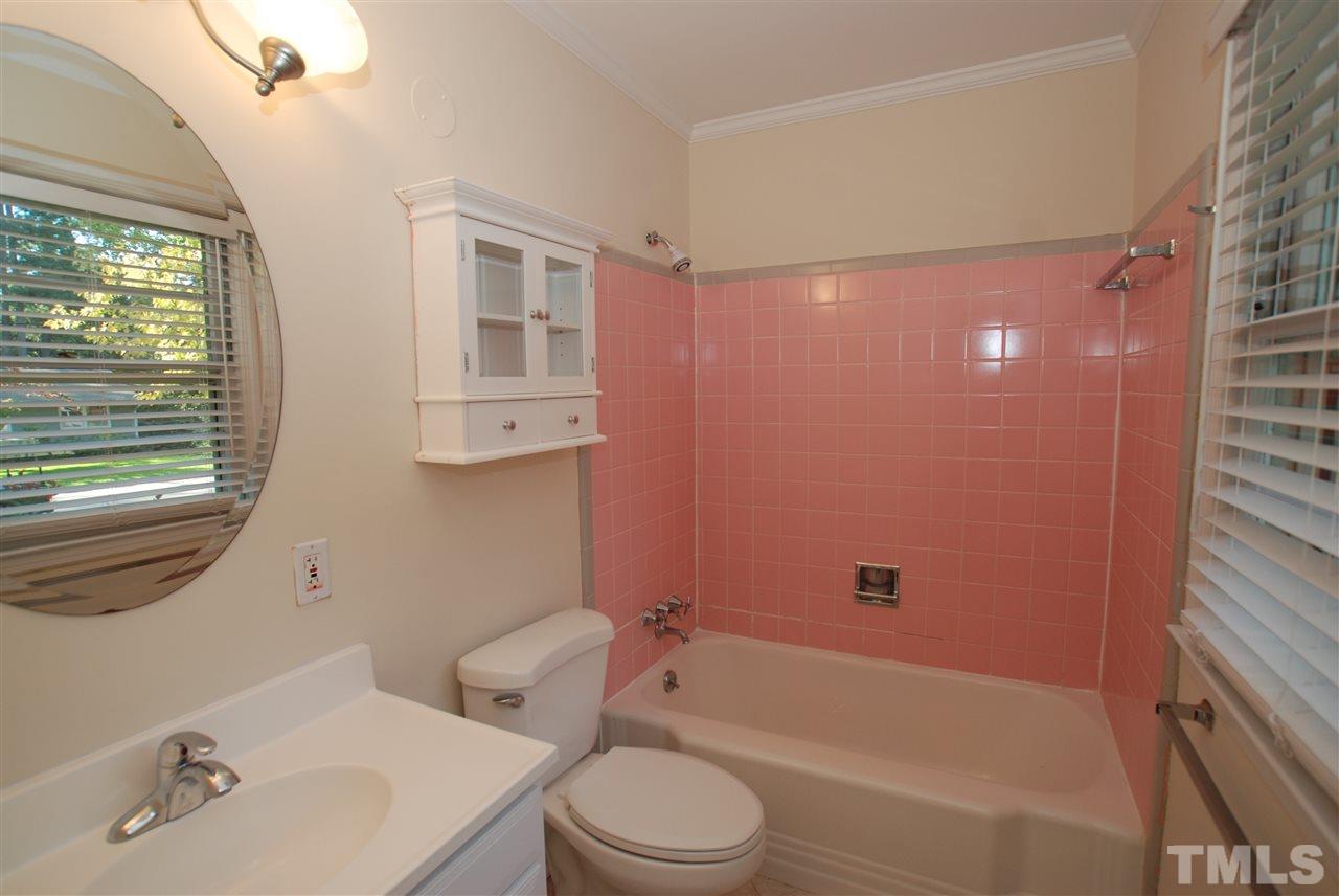 3404 Cherry Lane Raleigh, NC 27607 - Photo 14 of 19 a bathroom with a toilet a sink and bathtub
