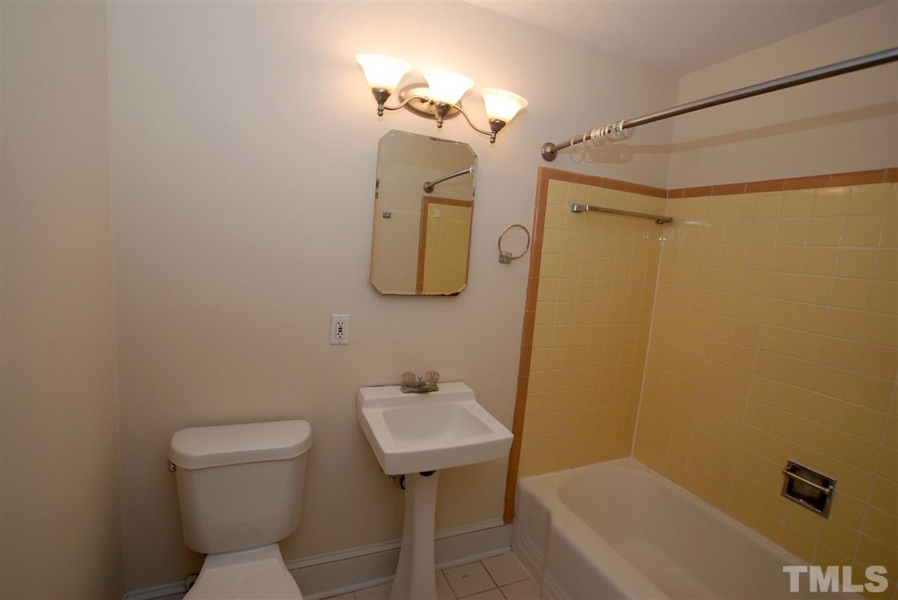 3404 Cherry Lane Raleigh, NC 27607 - Photo 15 of 19 a bathroom with a sink a toilet and shower
