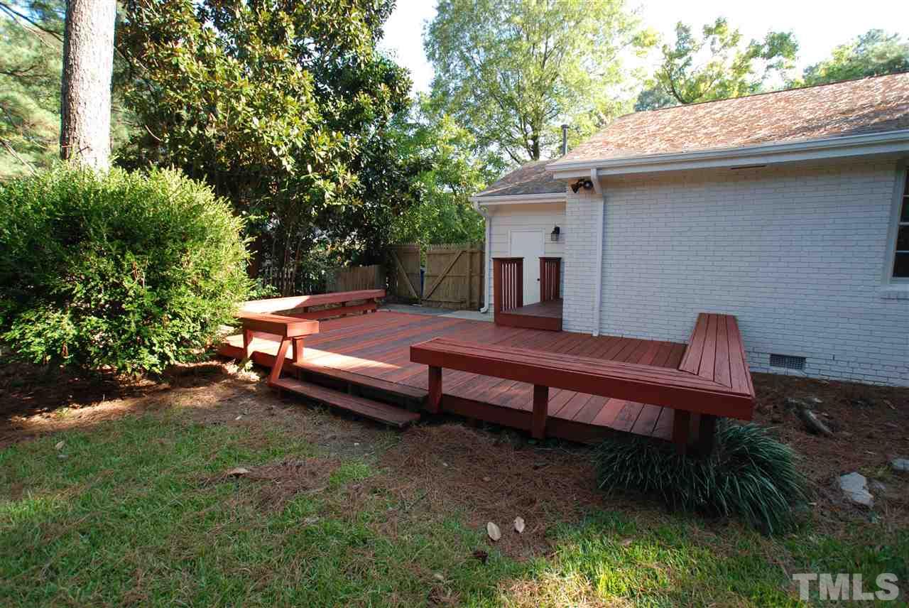 3404 Cherry Lane Raleigh, NC 27607 - Photo 17 of 19 a backyard of a house with a table and chairs