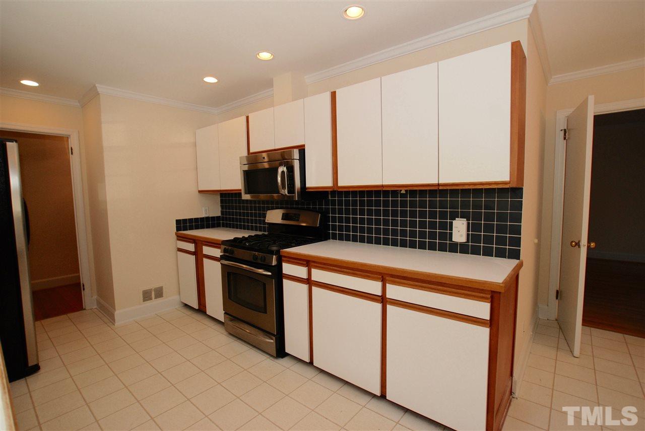 3404 Cherry Lane Raleigh, NC 27607 - Photo 4 of 19 a kitchen with a stove and a refrigerator