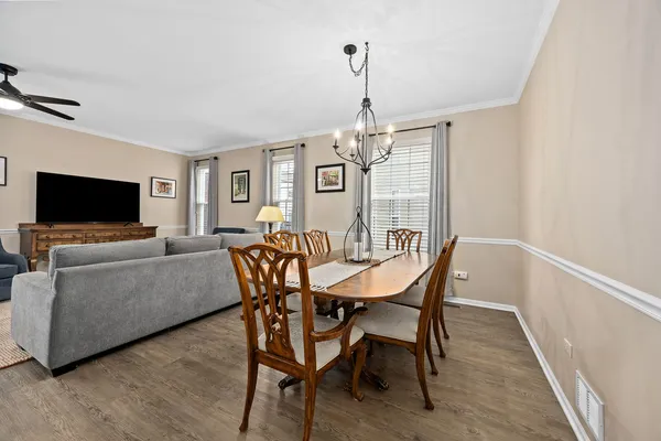 a view of a livingroom with furniture window and wooden floor