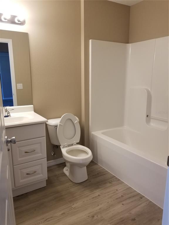 326 Clark Street Inverness, FL 34452 - Photo 17 of 19 a bathroom with a toilet a sink and bathtub