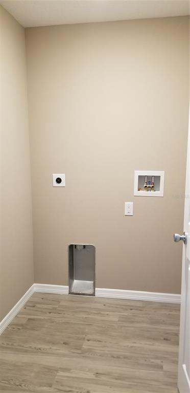 326 Clark Street Inverness, FL 34452 - Photo 8 of 19 a view of a room with wooden floor and white wall
