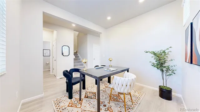 a table room with furniture and potted plant