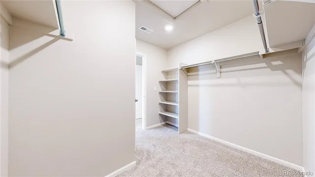 a view of an empty walk in closet