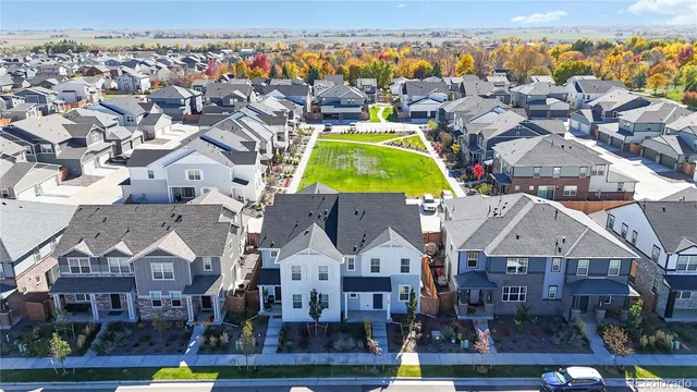 an aerial view of a pool patio kitchen swimming pool and outdoor seating