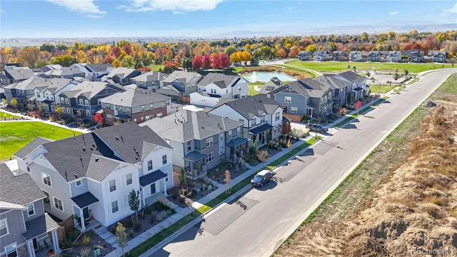 a view of a swimming pool with a table and chairs