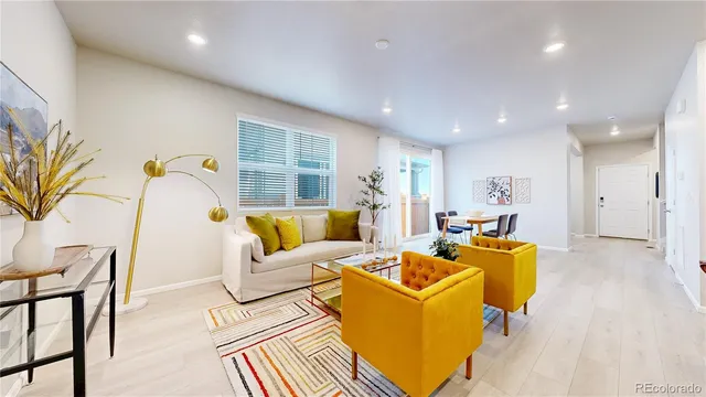 a living room with furniture and a table