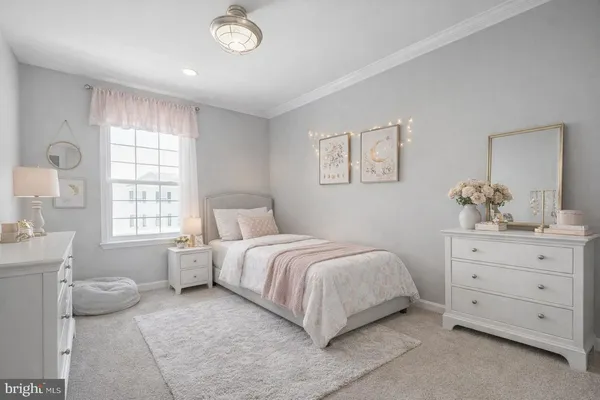 a spacious bedroom with a bed and window