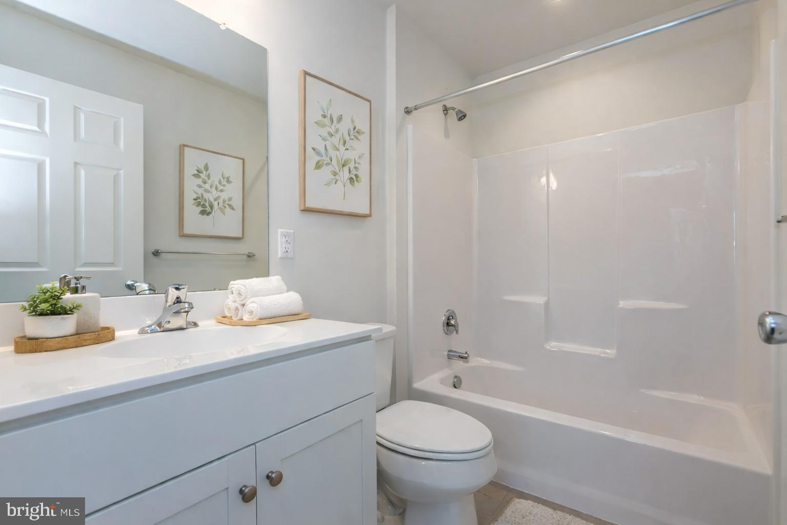 506 Park Road Spring City, PA 19475 - Photo 12 of 15 a bathroom with a granite countertop sink mirror toilet and bathtub