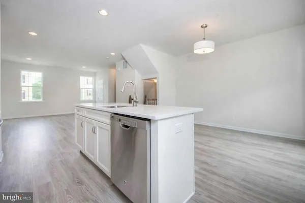a bathroom with a sink mirror and vanity