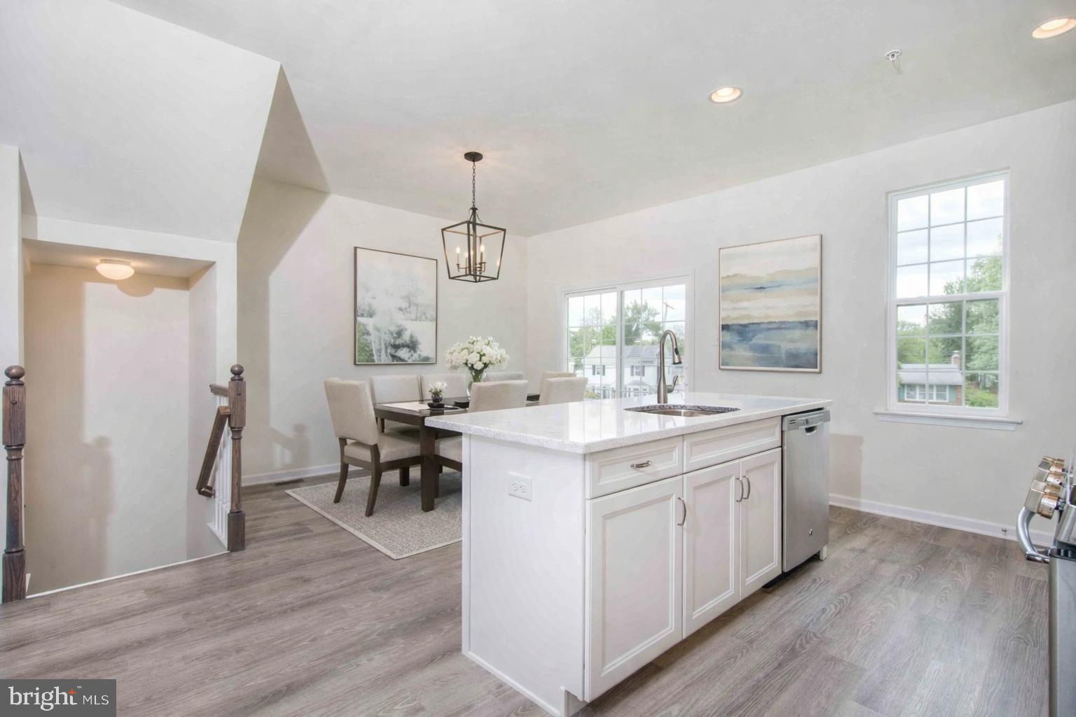 506 Park Road Spring City, PA 19475 - Photo 8 of 15 a large kitchen with kitchen island a sink a center island stainless steel appliances and a window