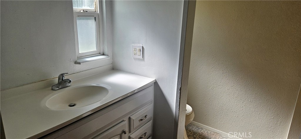 2920 Clark Road, Unit C12 Oroville, CA 95965 - Photo 9 of 17 a bathroom with a sink and mirror