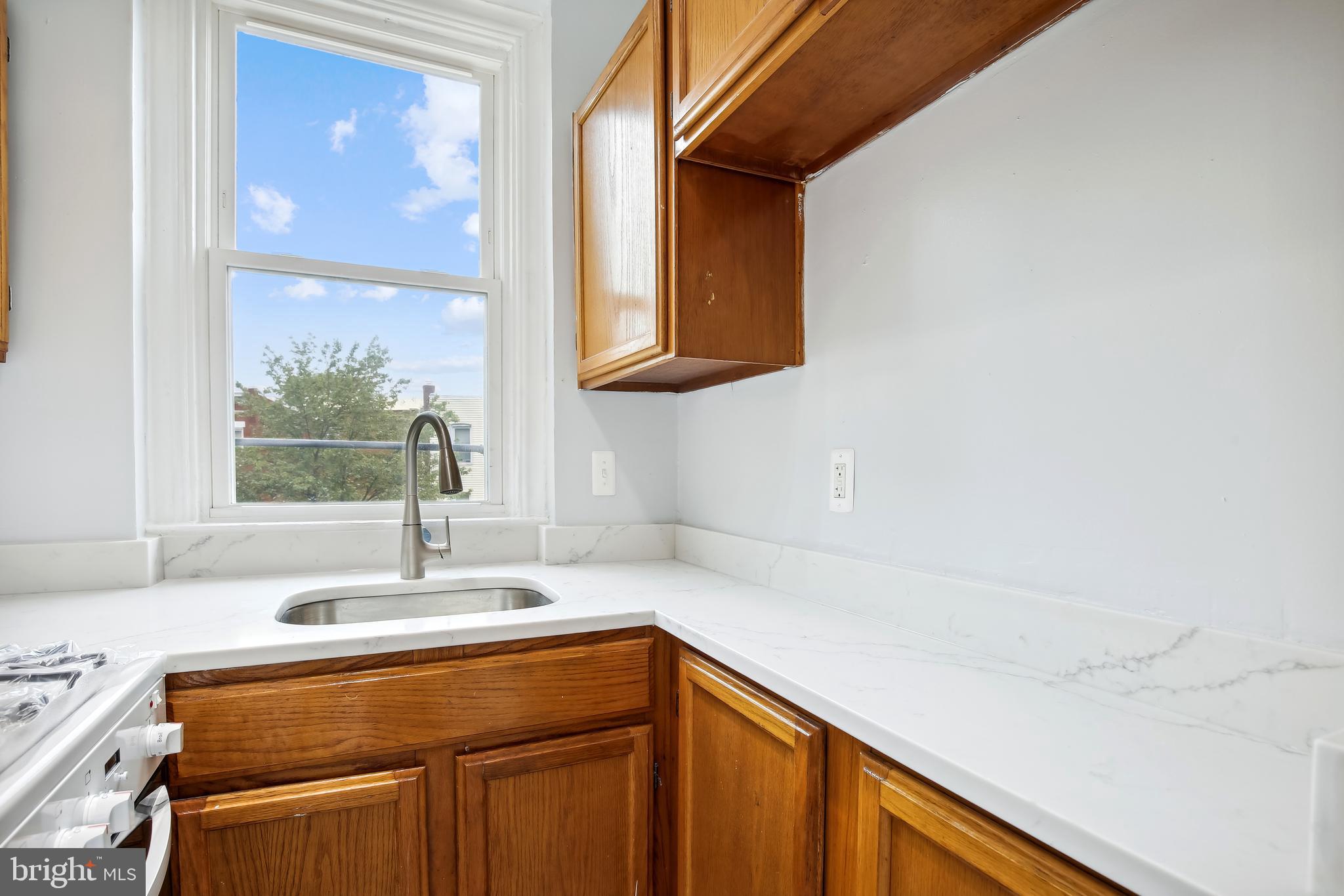 3701 13th Street Northwest, Unit 102 Washington, DC 20010 - Photo 12 of 38 a bathroom with a sink and a mirror