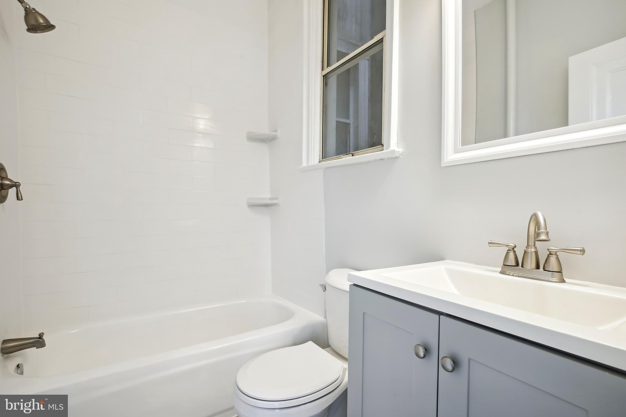 3701 13th Street Northwest, Unit 102 Washington, DC 20010 - Photo 16 of 38 a bathroom with a sink toilet and bathtub
