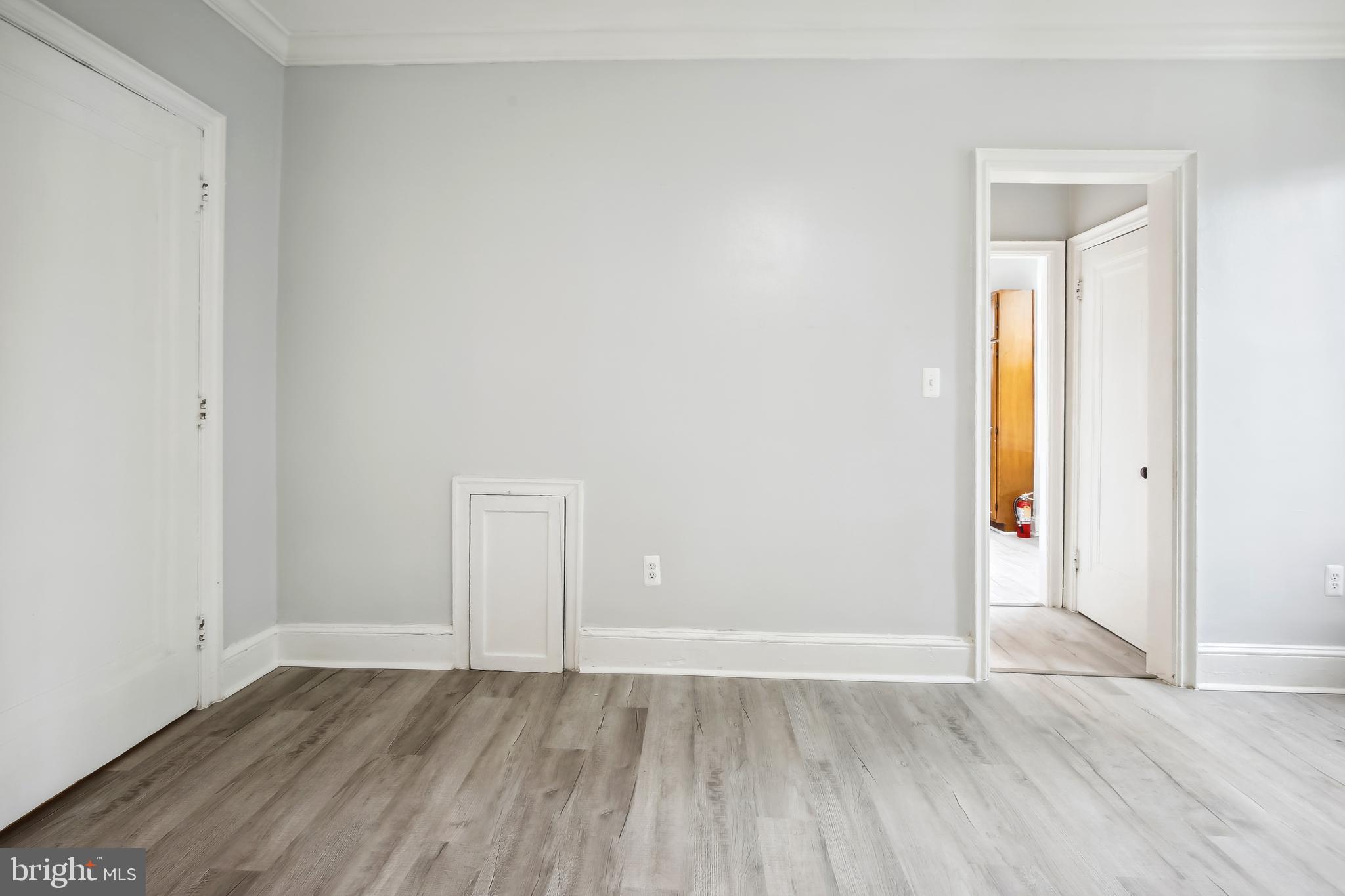 3701 13th Street Northwest, Unit 102 Washington, DC 20010 - Photo 4 of 38 an empty room with wooden floor and closet