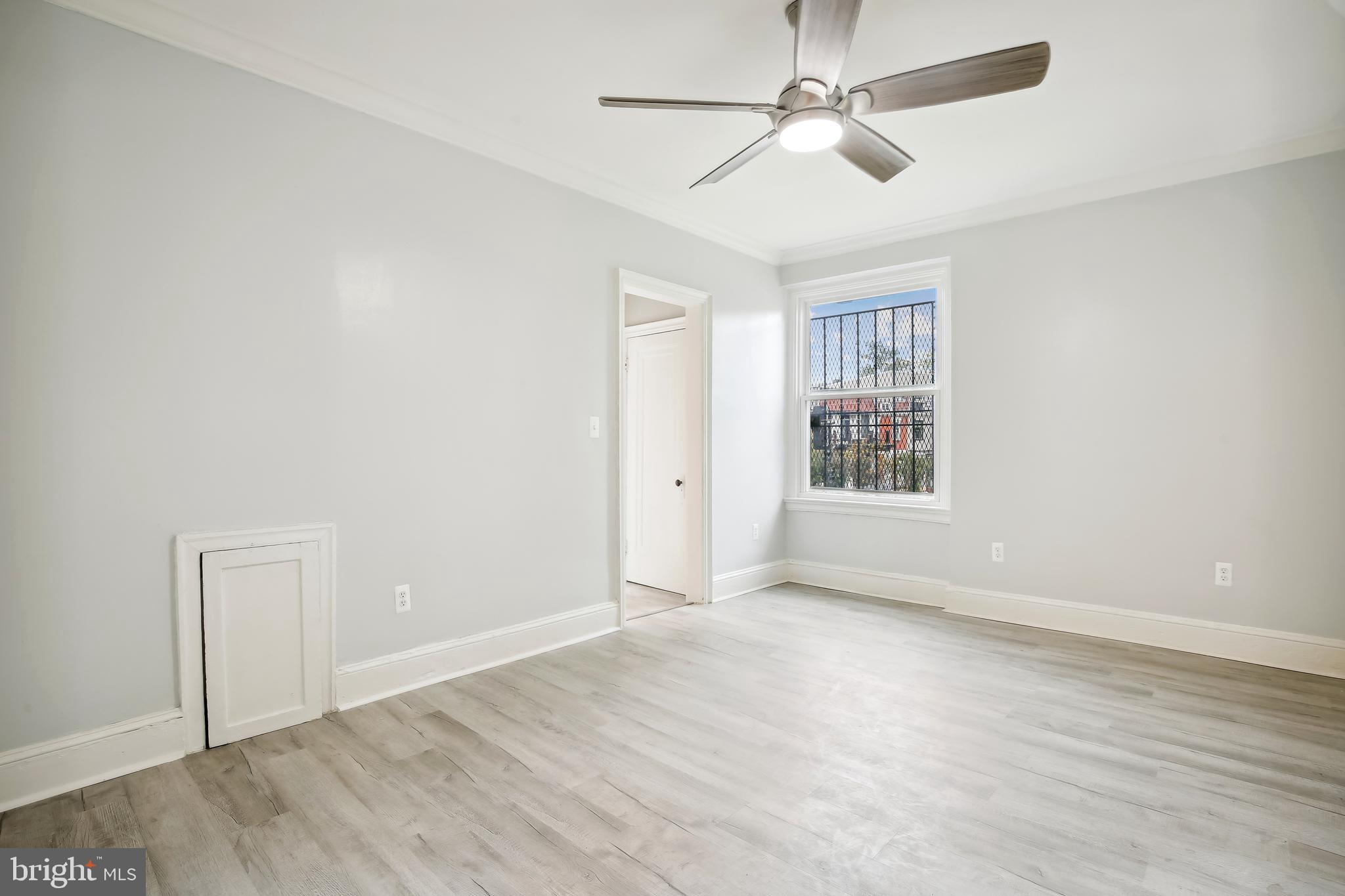 3701 13th Street Northwest, Unit 102 Washington, DC 20010 - Photo 5 of 38 wooden floor in an empty room with a window