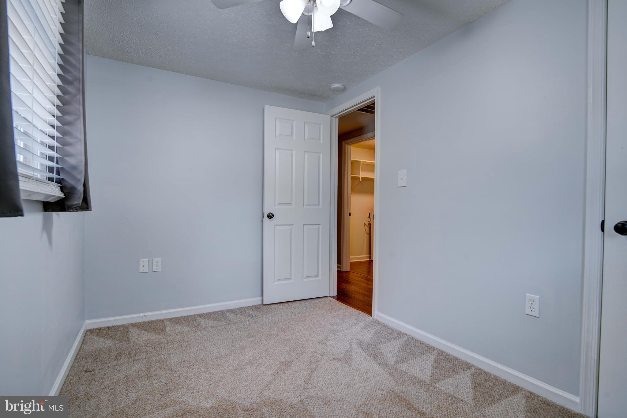 245 Newtown Road Solomons, MD 20688 - Photo 18 of 26 a view of empty room with a ceiling fan