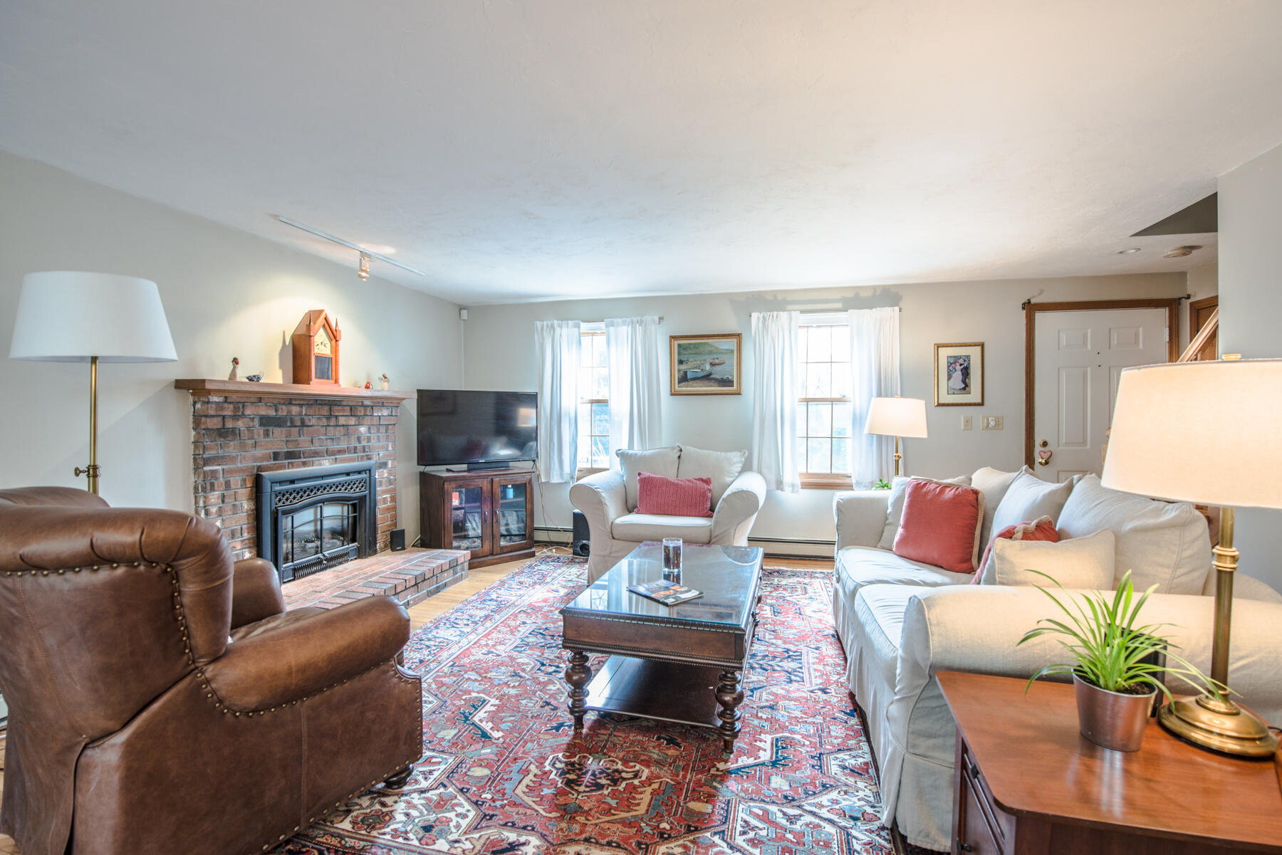 787 County Road Pocasset, MA 02559 - Photo 8 of 21 a living room with furniture a fireplace and a large window
