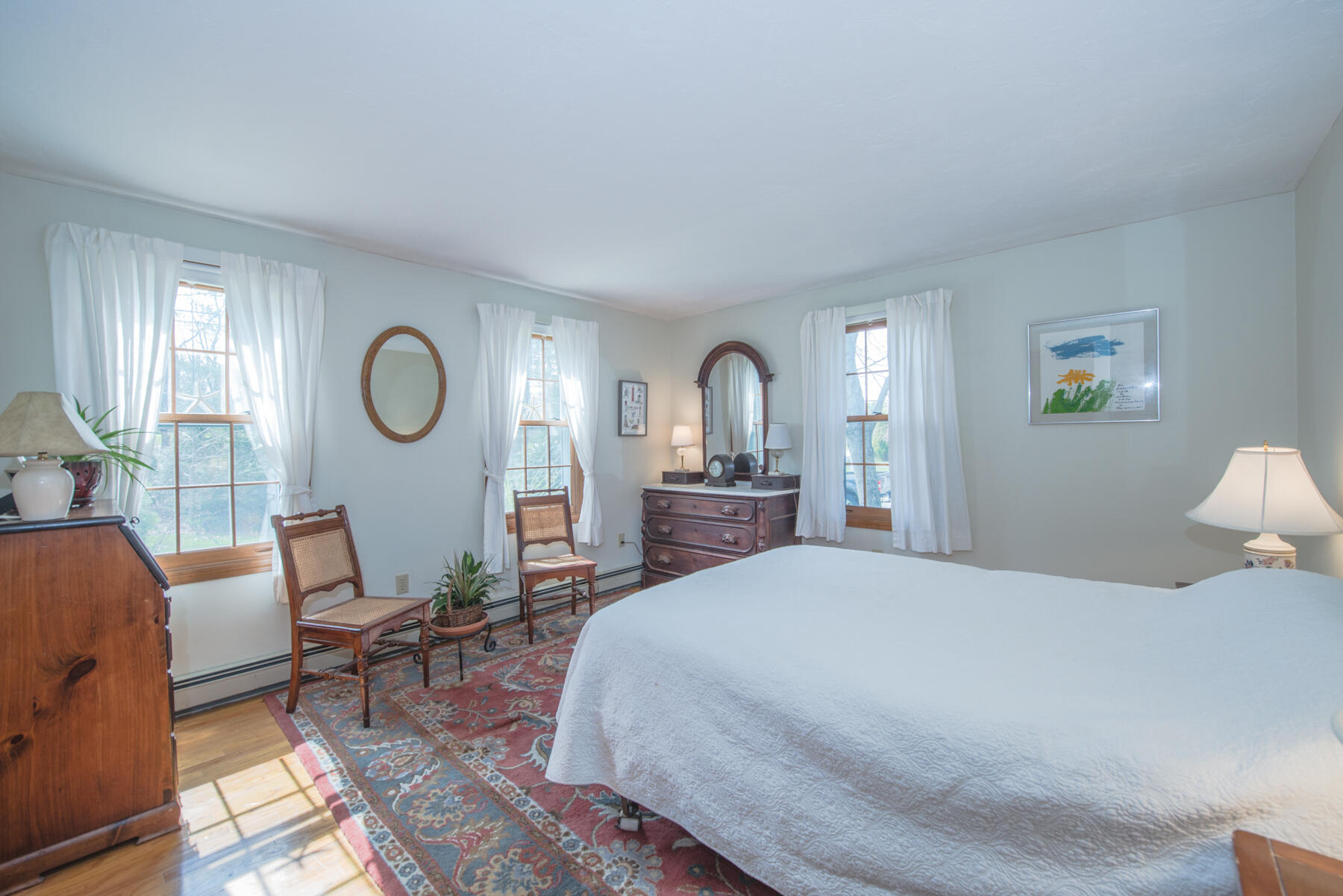 787 County Road Pocasset, MA 02559 - Photo 10 of 21 a spacious bedroom with a bed a window and dresser