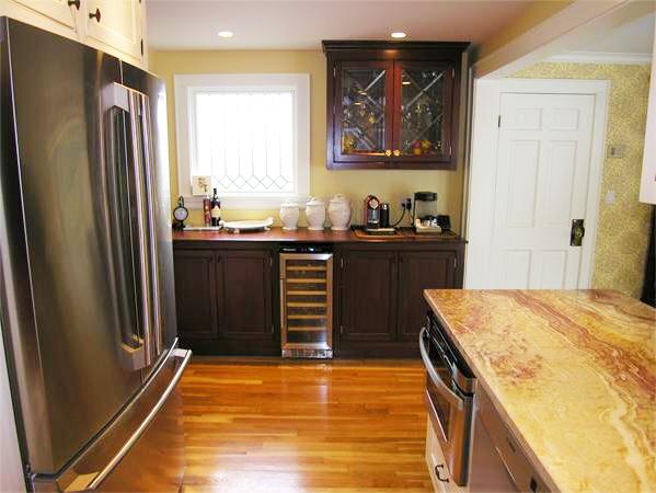 111 Hoover Road Needham, MA 02494 - Photo 15 of 28 a kitchen with stainless steel appliances granite countertop a refrigerator and a stove