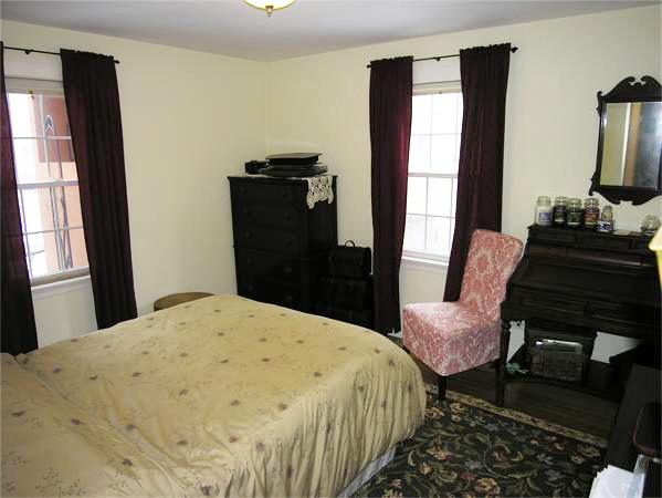 111 Hoover Road Needham, MA 02494 - Photo 17 of 28 a bedroom with a bed and wooden floor