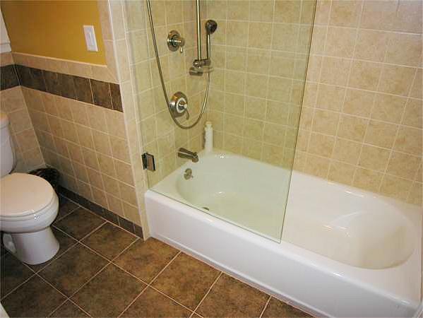 111 Hoover Road Needham, MA 02494 - Photo 18 of 28 a bathroom with a bathtub and a toilet