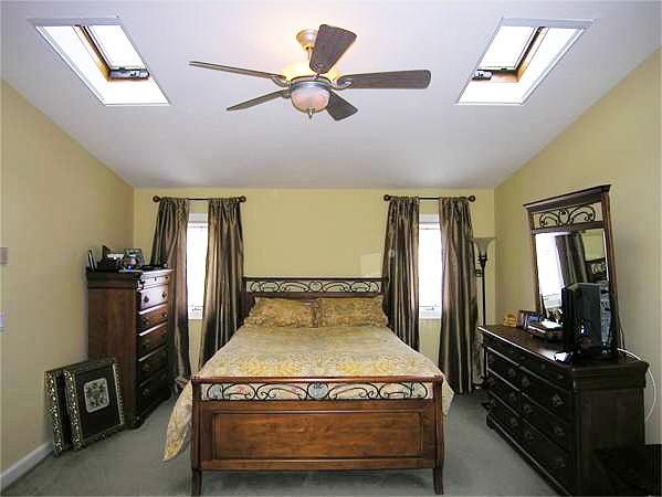 111 Hoover Road Needham, MA 02494 - Photo 20 of 28 a bedroom with a bed and wooden floor