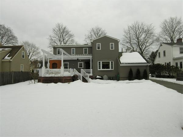 111 Hoover Road Needham, MA 02494 - Photo 2 of 28 a front view of a house with a yard covered in snow