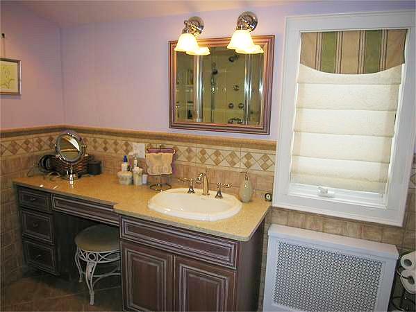 111 Hoover Road Needham, MA 02494 - Photo 24 of 28 a bathroom with a sink and a mirror