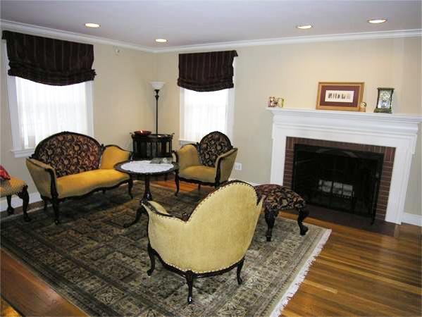 111 Hoover Road Needham, MA 02494 - Photo 5 of 28 a living room with furniture and a fireplace