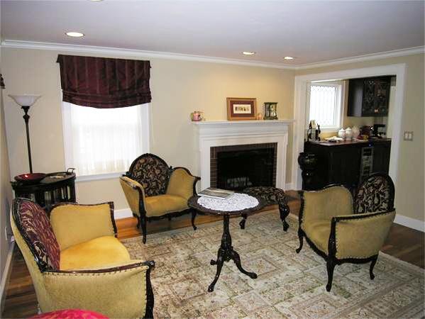 111 Hoover Road Needham, MA 02494 - Photo 8 of 28 a living room with furniture and a fireplace