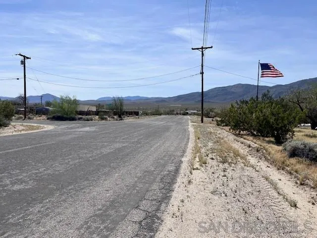 3462 Santa Saba Road, Unit 186 Borrego Springs, CA 92004 - Photo 2 of 7 a view of a dry yard with a tree
