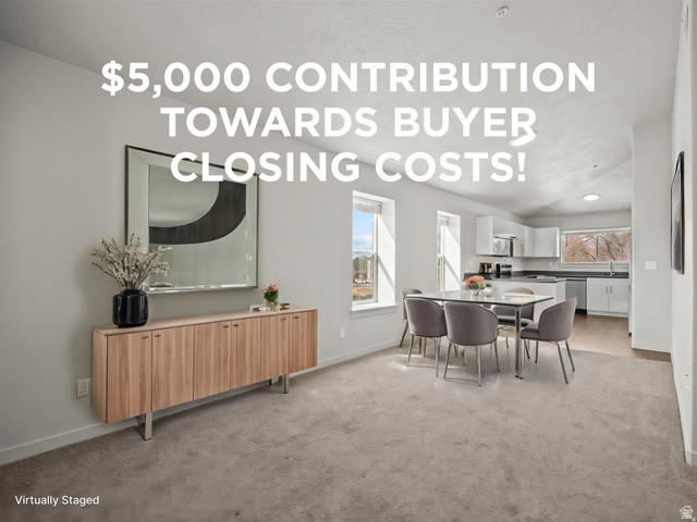 64 West 600 South, Unit C301 Springville, UT 84663 - Photo 1 of 1 Open-concept living space with light-colored carpeting