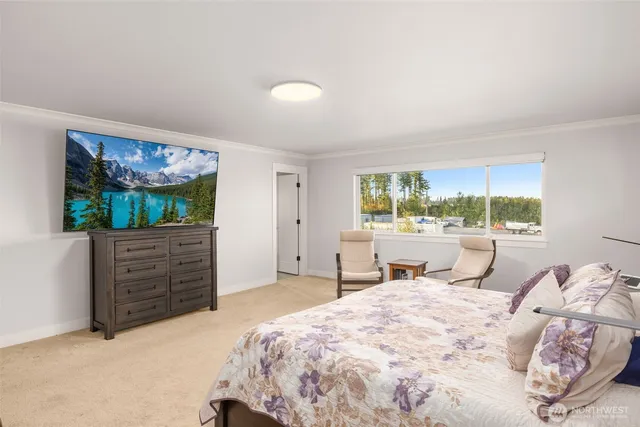 a bed room with a bed and a window