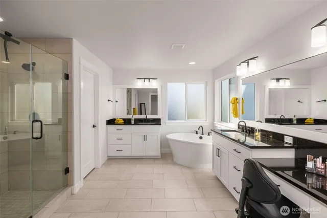 a large white kitchen with a large window