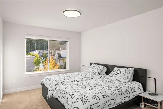 a bedroom with a bed and window