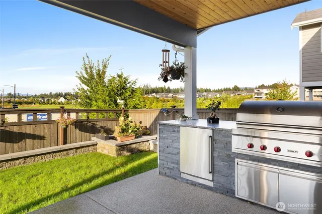 a front view of a house with a garden and swimming pool