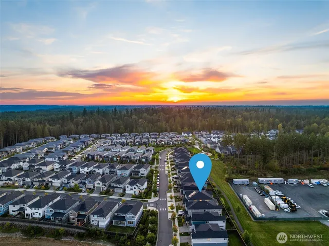 an aerial view of residential building with parking space